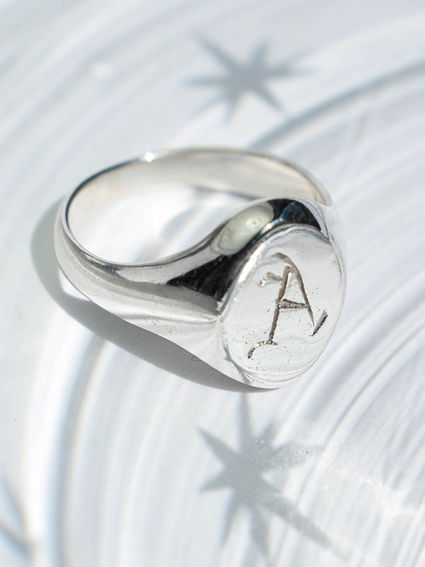 Oval signet ring with initial